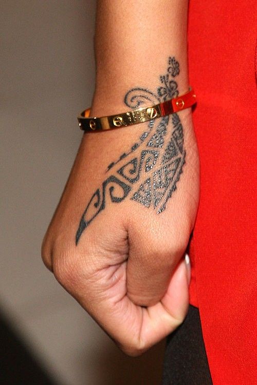 Tribal design on the back of her Hand